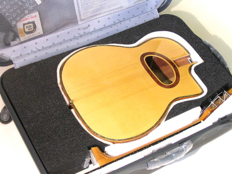Travelling practice guitar fits in yr suitcase... — DjangoBooks Forum